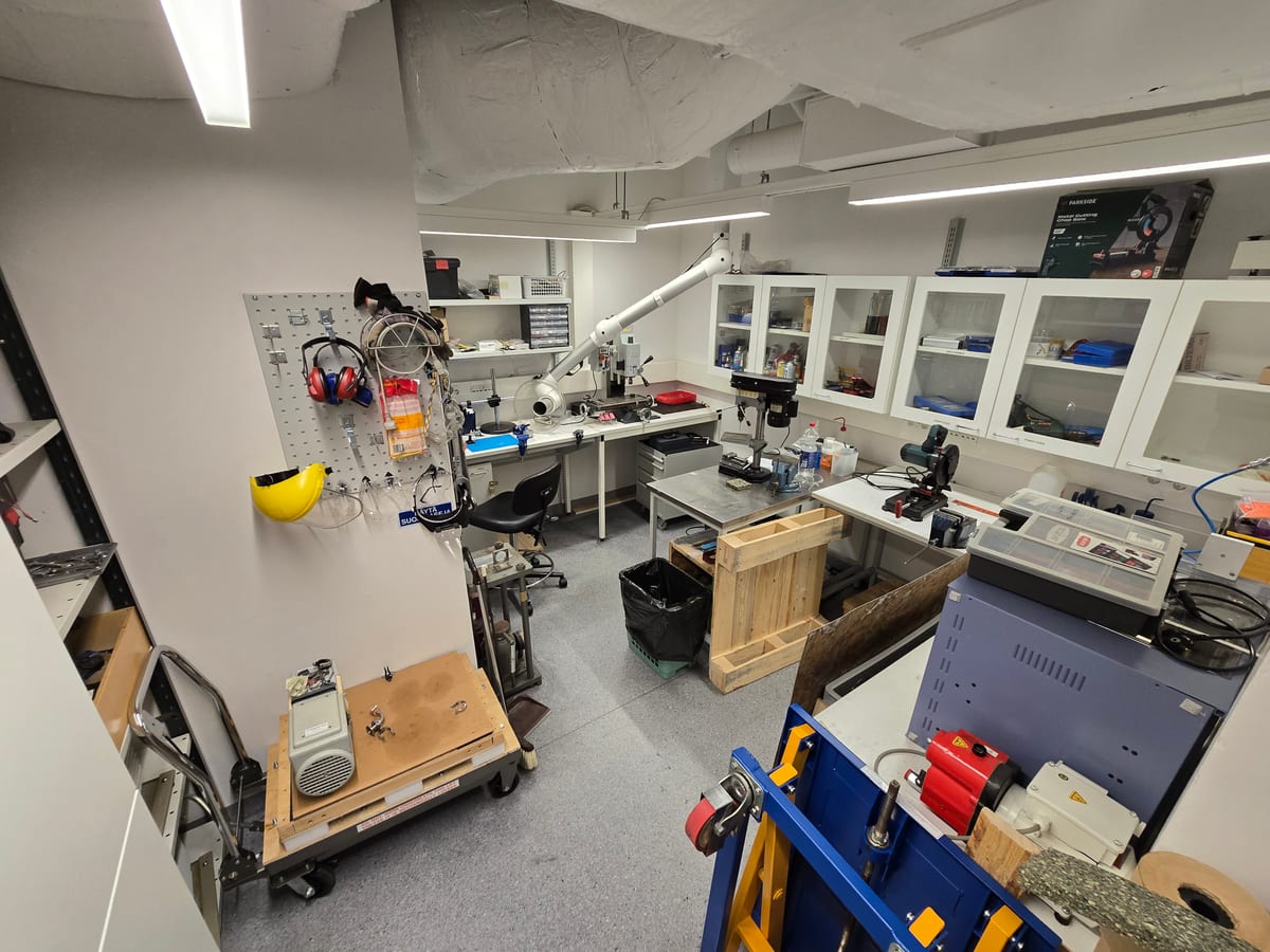 Workshop with milling machine, drill press and hand tools